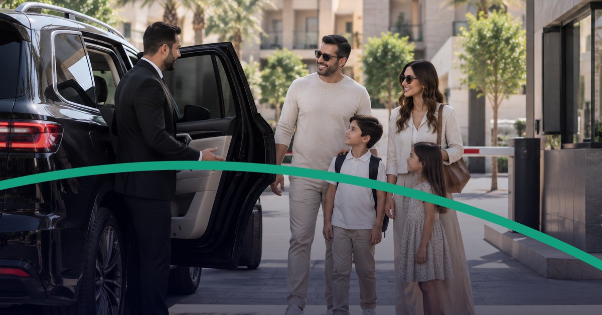 Family meeting a professional chauffeur beside an SUV at a Riyadh residential compound