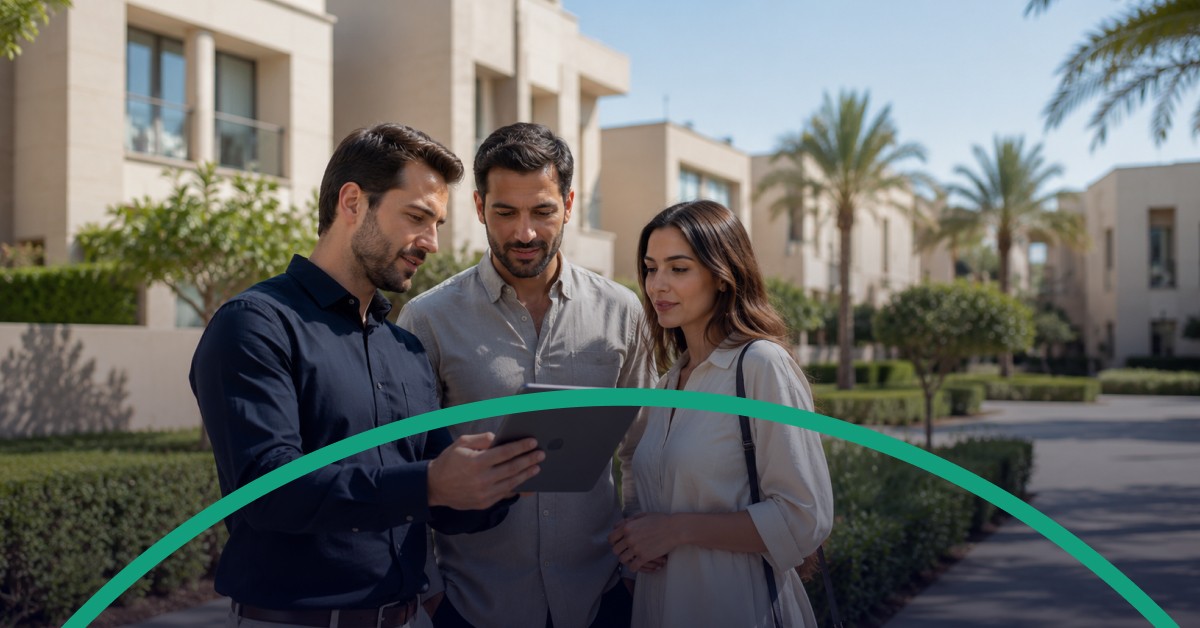 Jeddah compound manager reviewing a verified property profile with an expatriate couple.